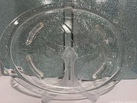 Full view of oval divided glass platter on stand