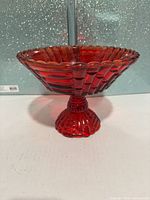 Full view of red pressed glass compote