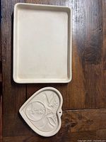 Rectangular stoneware pan and heart plaque shown together