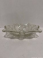 Side view of clear pressed glass bowl