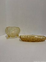 Wide shot of both amber glass pieces