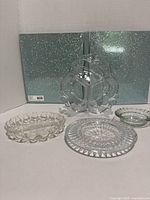 Group shot of all five pressed glass pieces