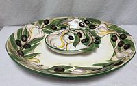 Top view of platter with dip dish in place showing full motif