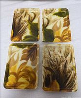 Top view of all four trays showing floral design and rectangular form