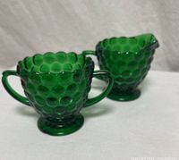 Front view of emerald green Bubble pattern sugar bowl and creamer