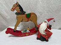 Rocking horse and Santa figurine together front view