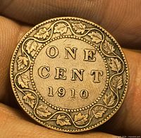 Reverse of 1910 Canadian one-cent coin showing ONE CENT 1910 and maple-leaf wreath