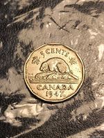 Reverse side showing beaver, denomination, date with maple leaf