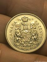 Reverse of 1969 Canadian 50-cent coin showing Coat of Arms and denomination