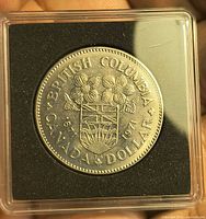 Reverse of coin showing British Columbia design in holder