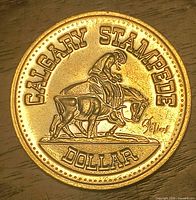 Obverse showing rodeo rider and CALGARY STAMPEDE DOLLAR legend