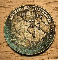 Reverse showing map of Canada, shield, motto, date 1939, green toning