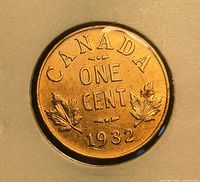Reverse side showing CANADA, ONE CENT, maple leaves, date 1932