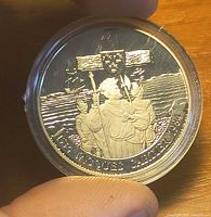Reverse showing Jacques Cartier design inside capsule
