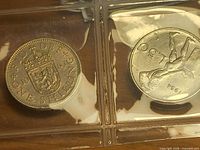 1963 one shilling reverse and Italian 50 lire reverse in plastic holder