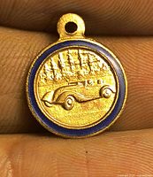 Reverse side with sports car relief and blue enamel edge