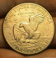 Reverse side showing eagle landing on Moon, denomination and legends
