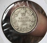 Reverse side showing crown, denomination, maple wreath, date 1910