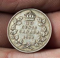 Reverse side showing denomination, wreath, date 1914