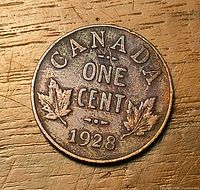 Reverse side showing CANADA ONE CENT 1928 with maple leaves