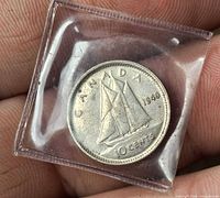 Reverse showing Bluenose schooner and 1940 date in plastic sleeve