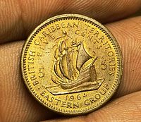 Reverse of coin showing ship, denomination, date