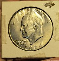 Obverse of 1974 Eisenhower dollar in 2x2 holder