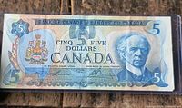 Obverse of 1979 Canada $5 note showing portrait, serial, signatures