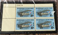 Full view of the 2×2 block of stamps in sleeve, showing plate number 29678 and full selvage