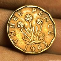 Reverse showing thrift plant, legend THREE PENCE, date 1943