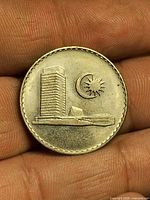 Obverse view: Parliament House, crescent, star