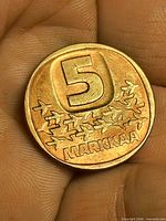 Obverse showing numeral 5 and bird motif