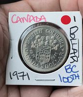 Reverse of 1971 British Columbia dollar coin in 2x2 holder
