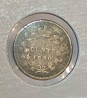 Reverse of 1880 Canada 5 cents coin showing crown, denomination and date