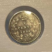 Reverse of 1891 Canadian 5-cent coin showing crown, denomination and date