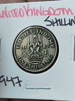 Reverse: crowned lion on crown, date 1947, ONE SHILLING legend visible