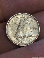 Reverse showing Bluenose schooner and date 1952