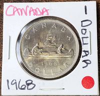 Front view of 1968 Canada Voyageur dollar in 2x2 flip