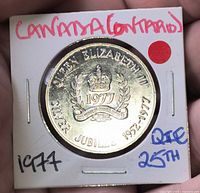 Obverse of 1977 Silver Jubilee medallion in 2×2 holder