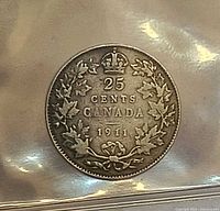 Reverse of 1911 Canadian quarter showing 25 Cents Canada wreath design