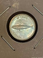 Reverse of 1967 Canadian 10 cent coin in holder