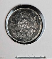 Reverse of 1902 Canada 5 cents coin showing denomination, maple leaves and crown
