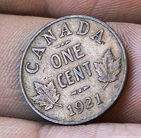 Reverse side showing CANADA, ONE CENT, maple leaves, date 1921