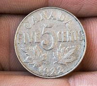 Reverse side showing CANADA FIVE CENTS, maple leaves, 1922 date