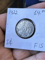 Reverse side showing CANADA FIVE CENTS 1922 in holder