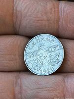 Reverse of 1928 Canadian 5-cent coin