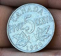 Reverse showing CANADA FIVE 5 CENTS 1928 with maple leaves