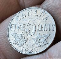 Reverse side showing denomination, maple leaves and 1929 date