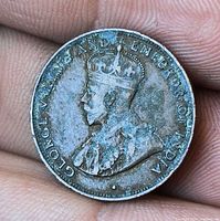 Obverse side showing King George V portrait and legend