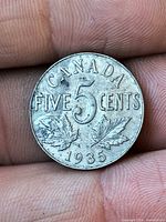 Reverse side showing CANADA FIVE CENTS 1935 with maple leaves